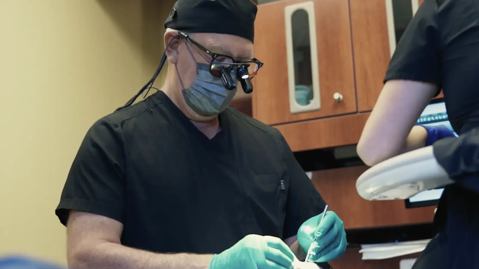 image of doctor hester working on a patient at a dental office